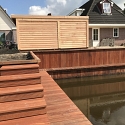 Walbeschoeiing en tuinhuis met veranda Opeinde